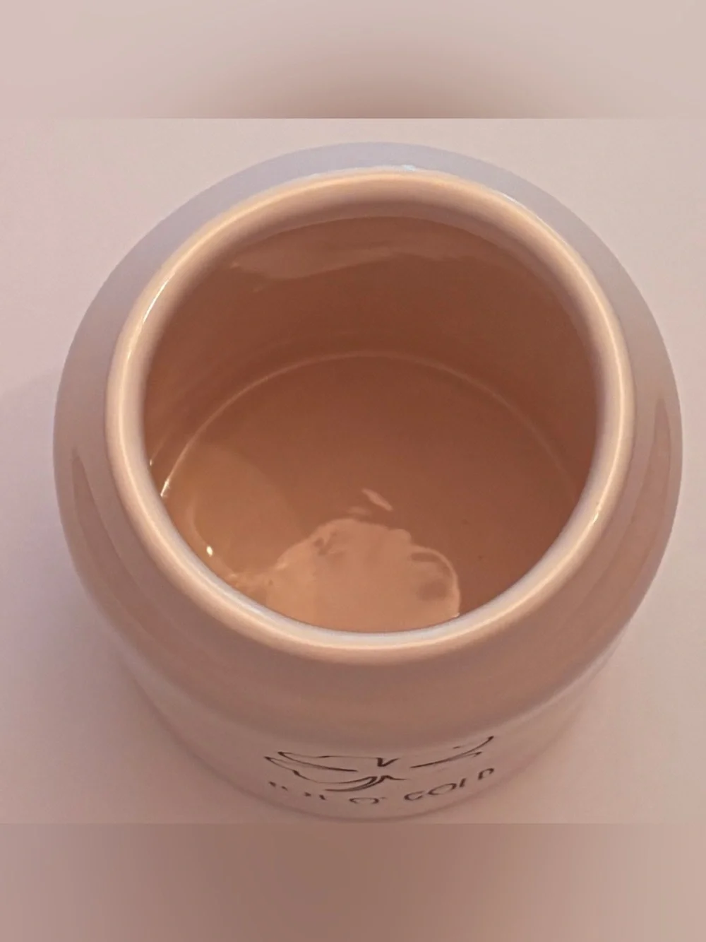 Rae Dunn off White Ceramic 'POT O’GOLD’ Canister with Green Handle covered lid.